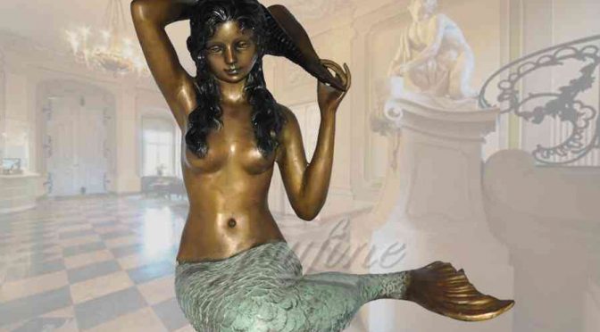 Elegant young sitting bronze mermaid statue with seashell
